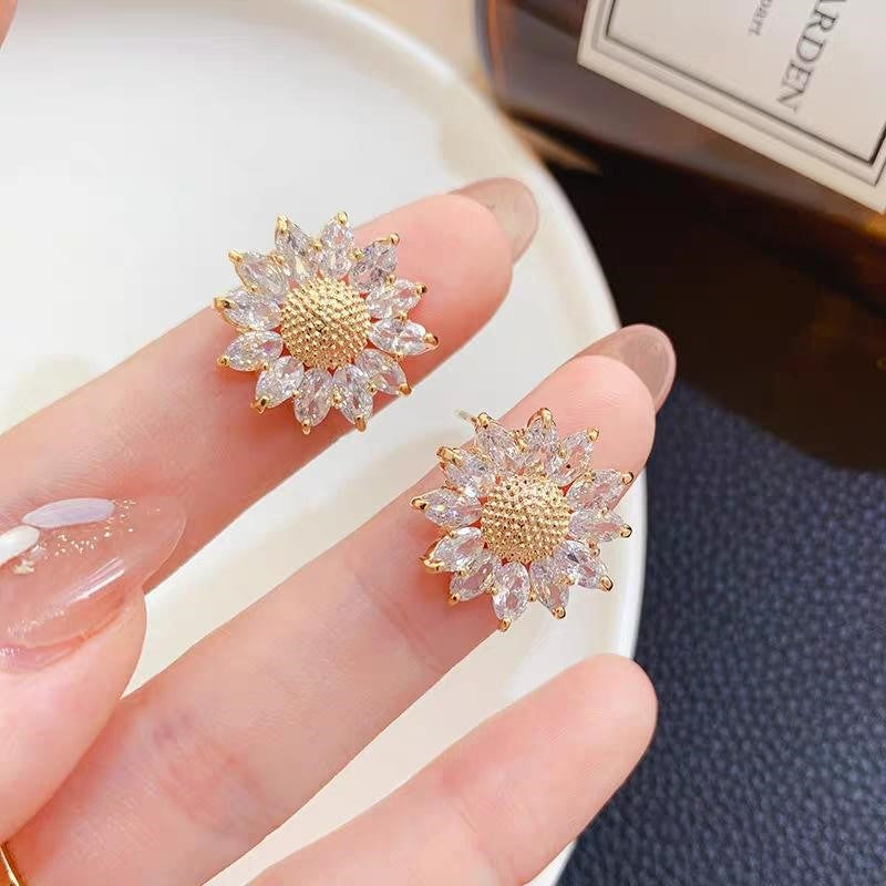 aretes de girasol, aretes giratorios, aretes antiestrés , aretes anti ansiedad, aretes dorados con piedras
