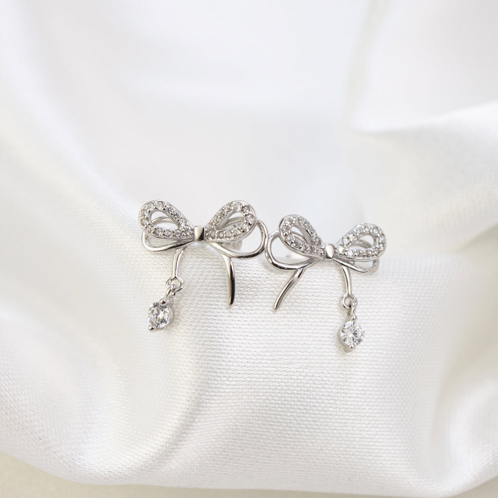 aretes coquette, aretes de lazo, aretes de lazo plateados, aretes plateados