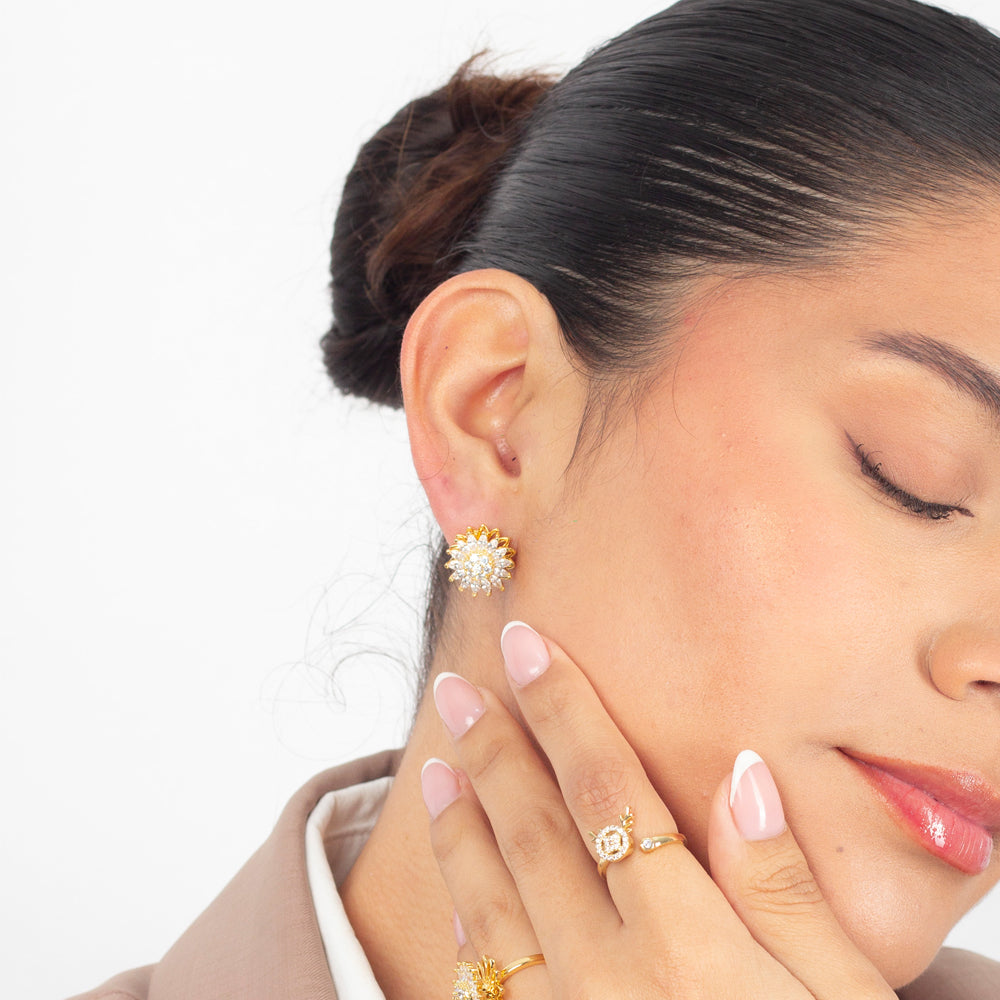 aretes de girasol, aretes giratorios, aretes antiestrés , aretes anti ansiedad, aretes dorados con piedras