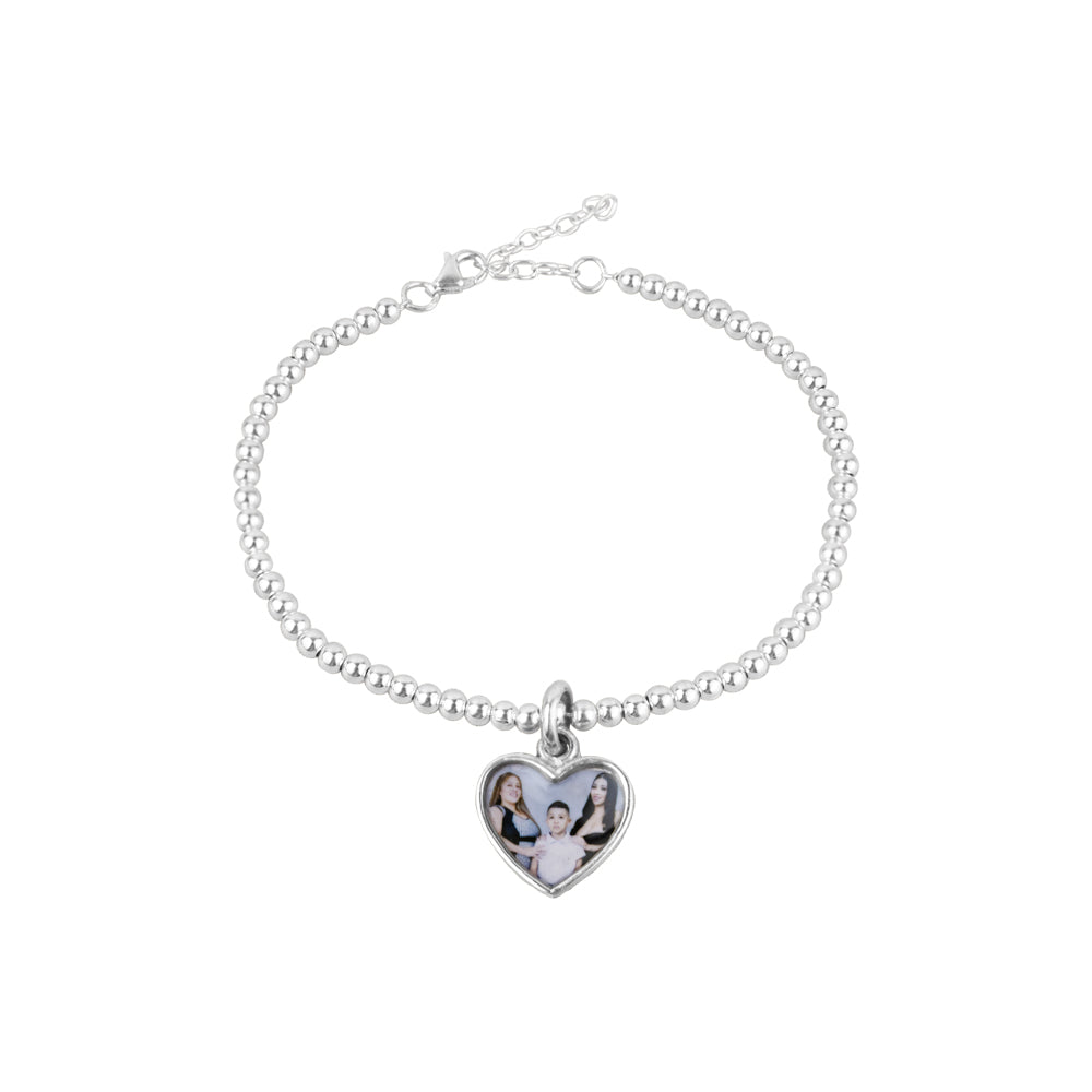 Pulsera de plata con portafoto. Pulsera de bolas plateadas con dije de corazón para colocar foto