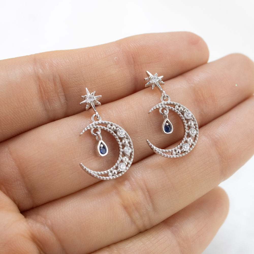 Pendientes de luna y estrellas plateados con piedra colgante azul y cristales