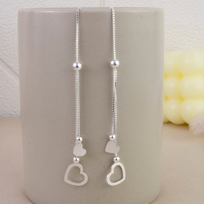 Aretes Largo Pasante Corazones Plata