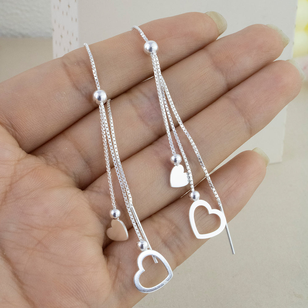 Aretes Largo Pasante Corazones Plata