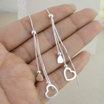 Aretes Largo Pasante Corazones Plata